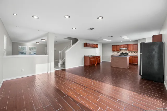 a view of kitchen with furniture and wooden floor