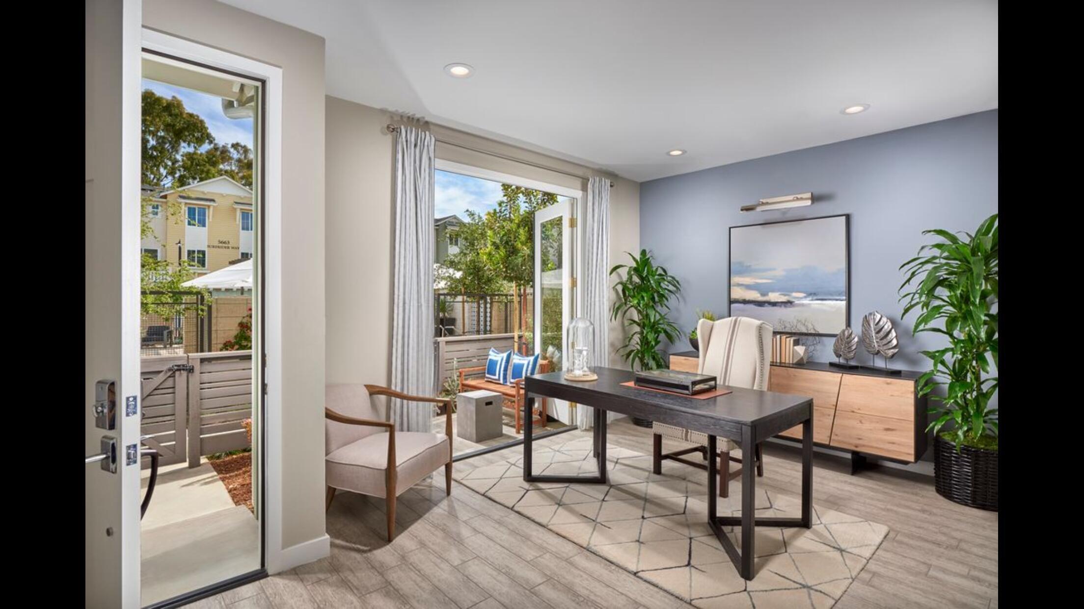 a workspace with furniture and a potted plant