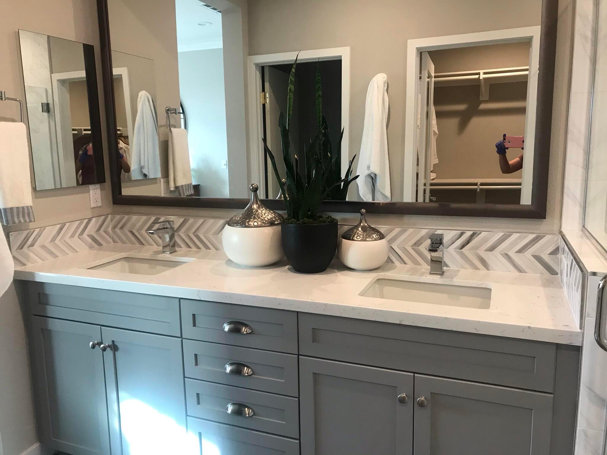576 Asilomar Way, Unit 103 Goleta, CA 93117 - Photo 6 of 27 a bathroom with sink and mirror