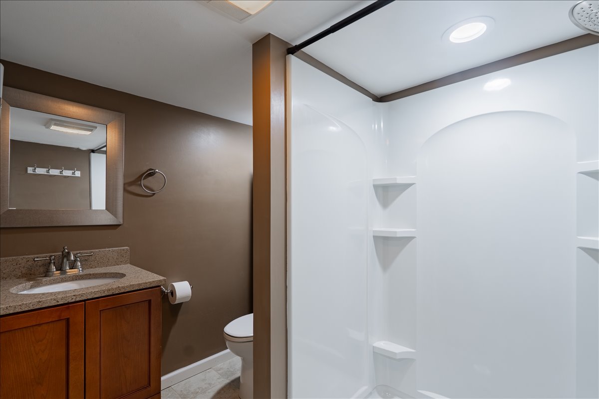 8 Felton Place Bloomington, IL 61701 - Photo 20 of 31 a bathroom with a granite countertop sink toilet and mirror