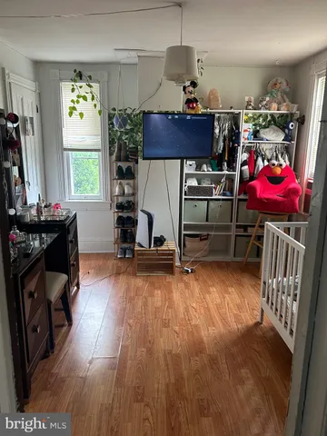 a view of a workspace with furniture gym equipment and windows