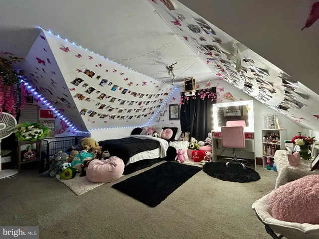 a bed room with furniture and a chandelier
