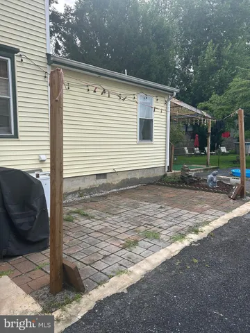 a view of a backyard with table and chairs