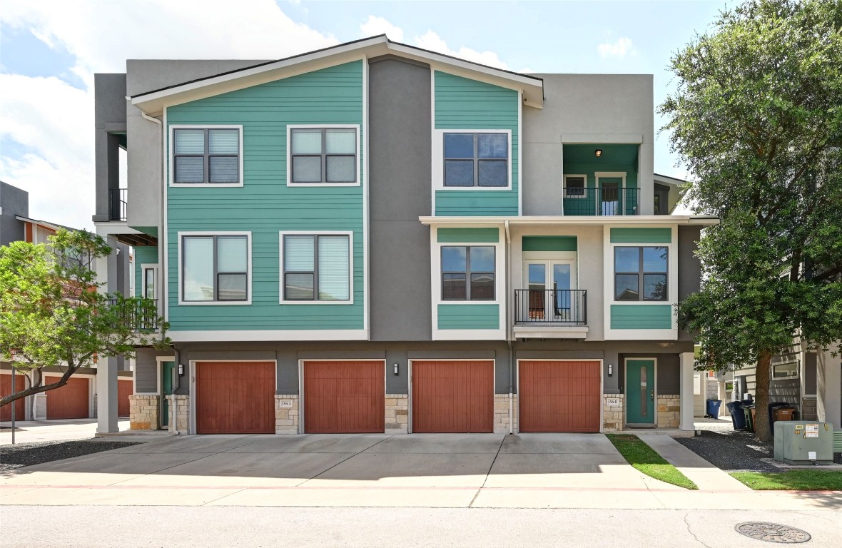 1504 Lorraine Loop, Unit B Austin, TX 78758 - Photo 1 of 25 a front view of a house with a garden