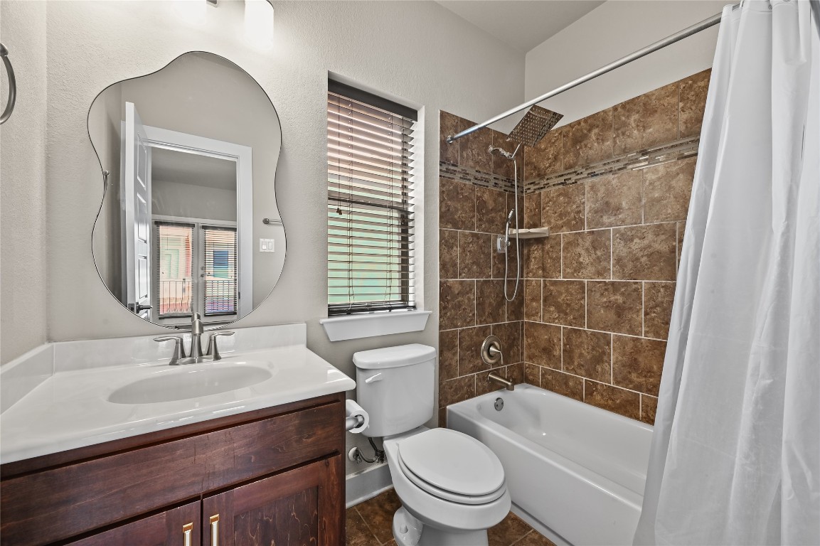 1504 Lorraine Loop, Unit B Austin, TX 78758 - Photo 14 of 25 a bathroom with a sink toilet and shower
