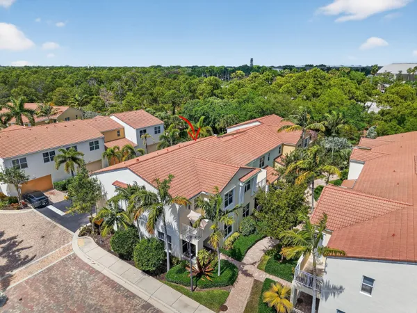 an aerial view of a house and outdoor space