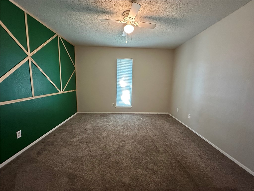 1506 Briar Street Portland, TX 78374 - Photo 27 of 40 an empty room with ceiling fan and window