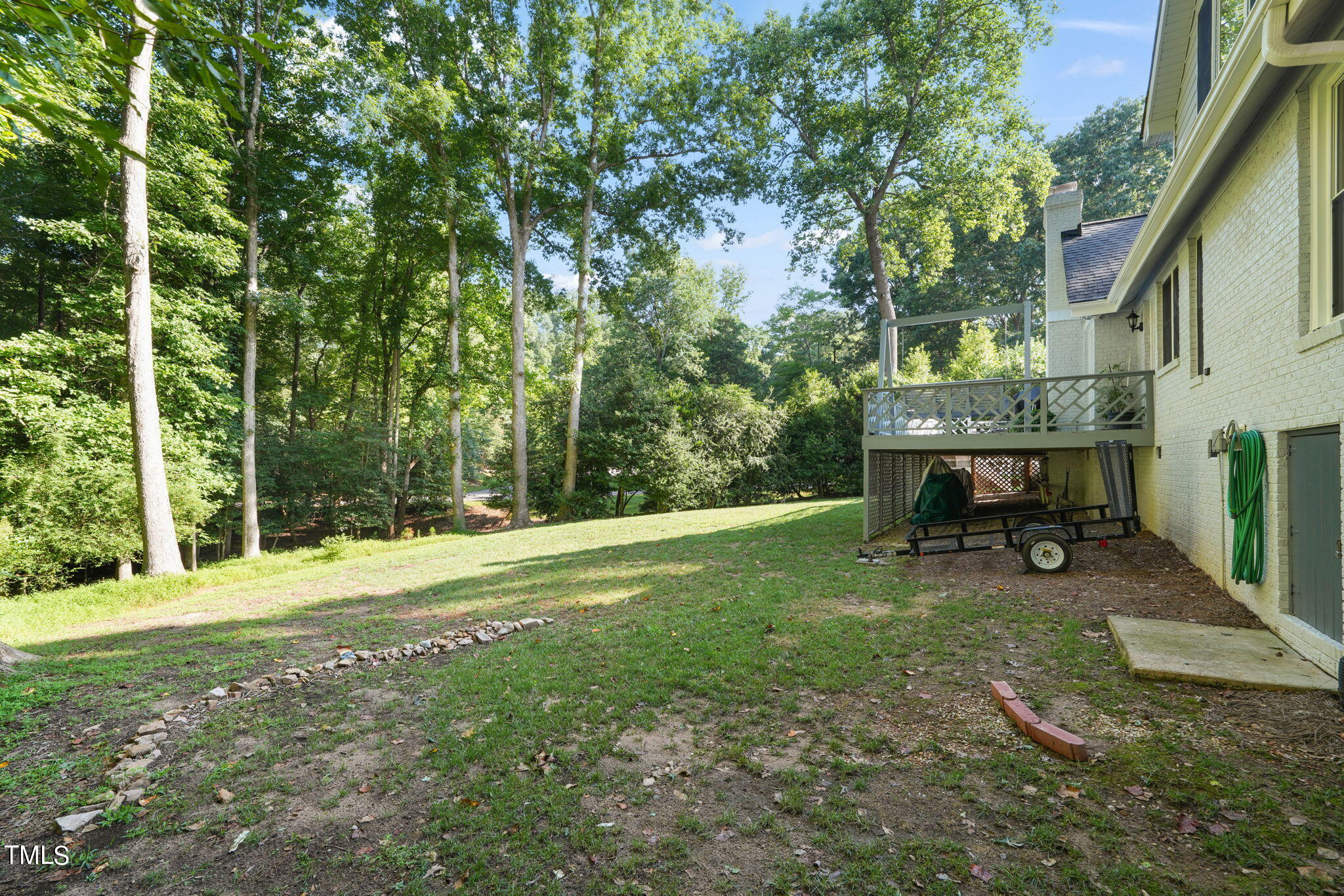12717 Lindley Drive Raleigh, NC 27614 - Photo 40 of 45 a backyard of a house with table and chairs