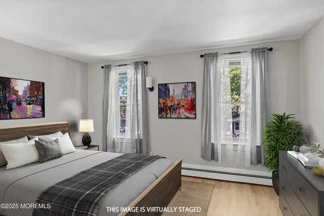 a bedroom with furniture and a potted plant