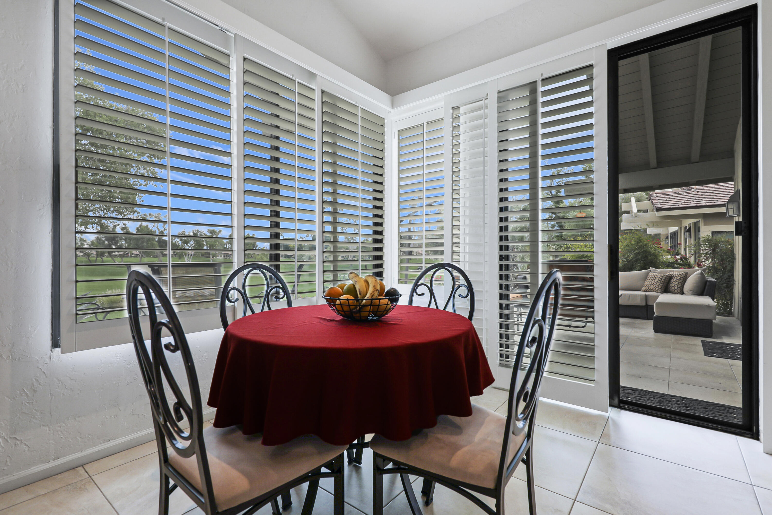 148 Deer Spring Way Palm Desert, CA 92211 - Photo 13 of 54 a view of a dining room with furniture and window