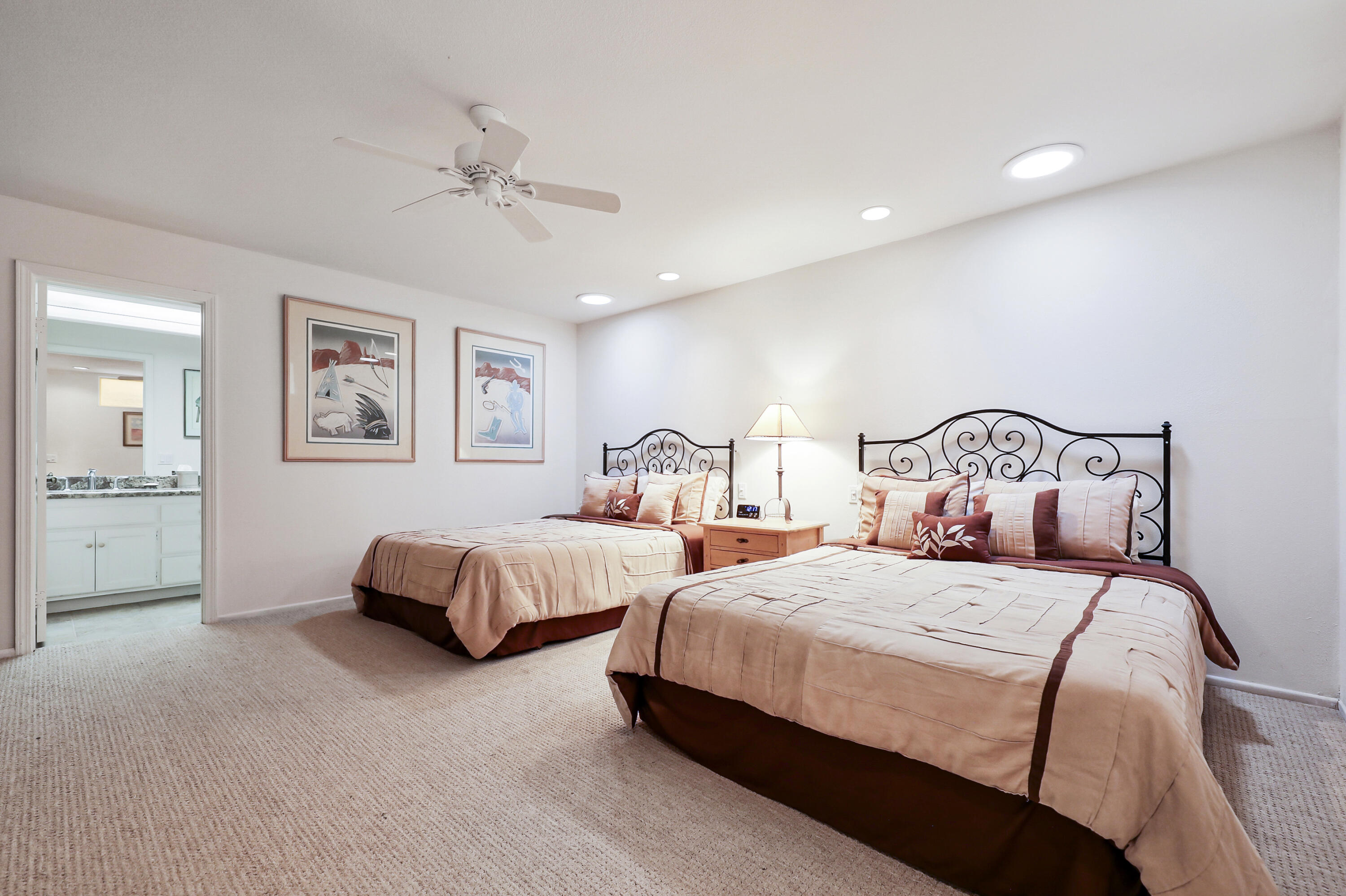 148 Deer Spring Way Palm Desert, CA 92211 - Photo 14 of 54 a bedroom with bed and window