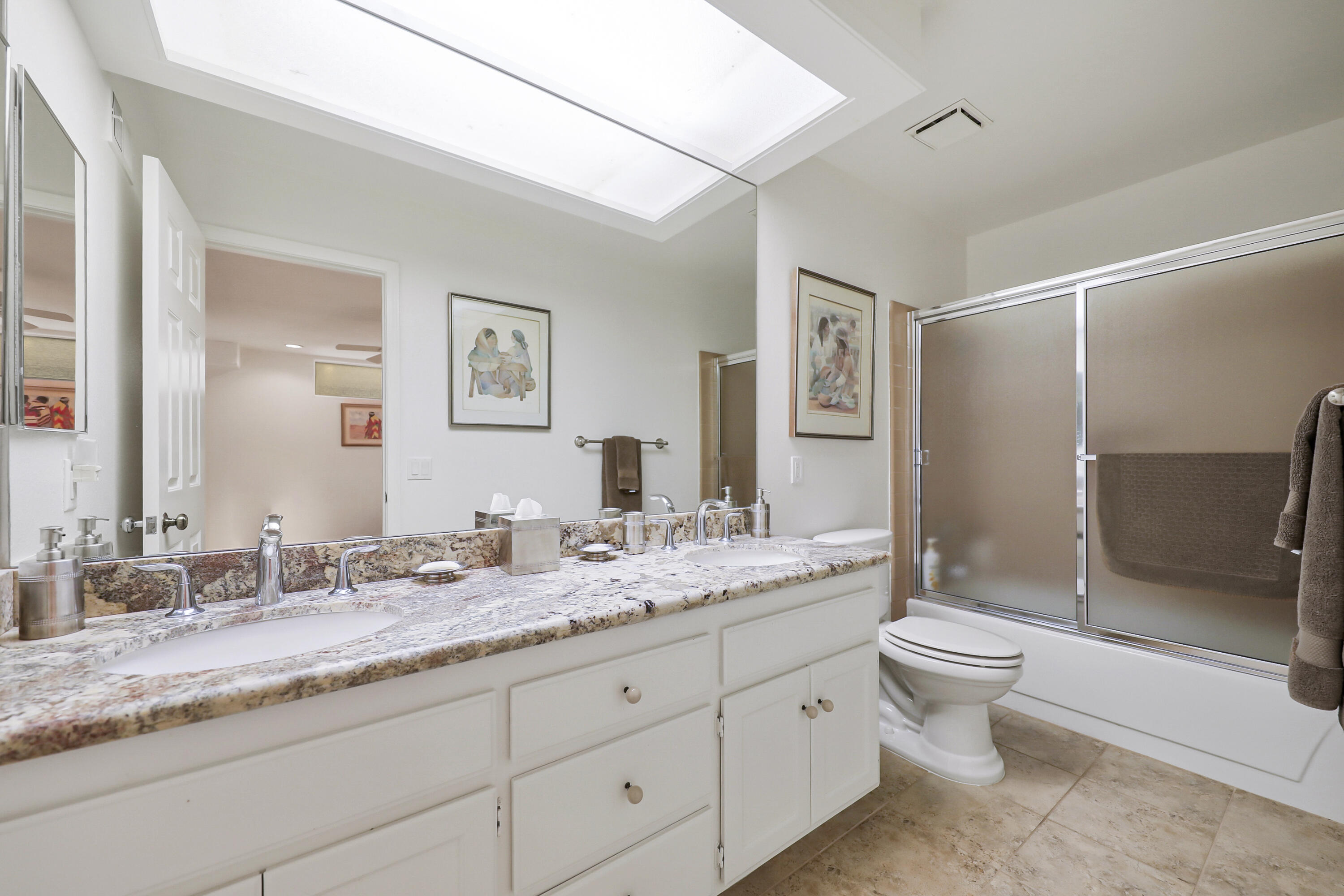 148 Deer Spring Way Palm Desert, CA 92211 - Photo 15 of 54 a bathroom with a granite countertop sink toilet and shower