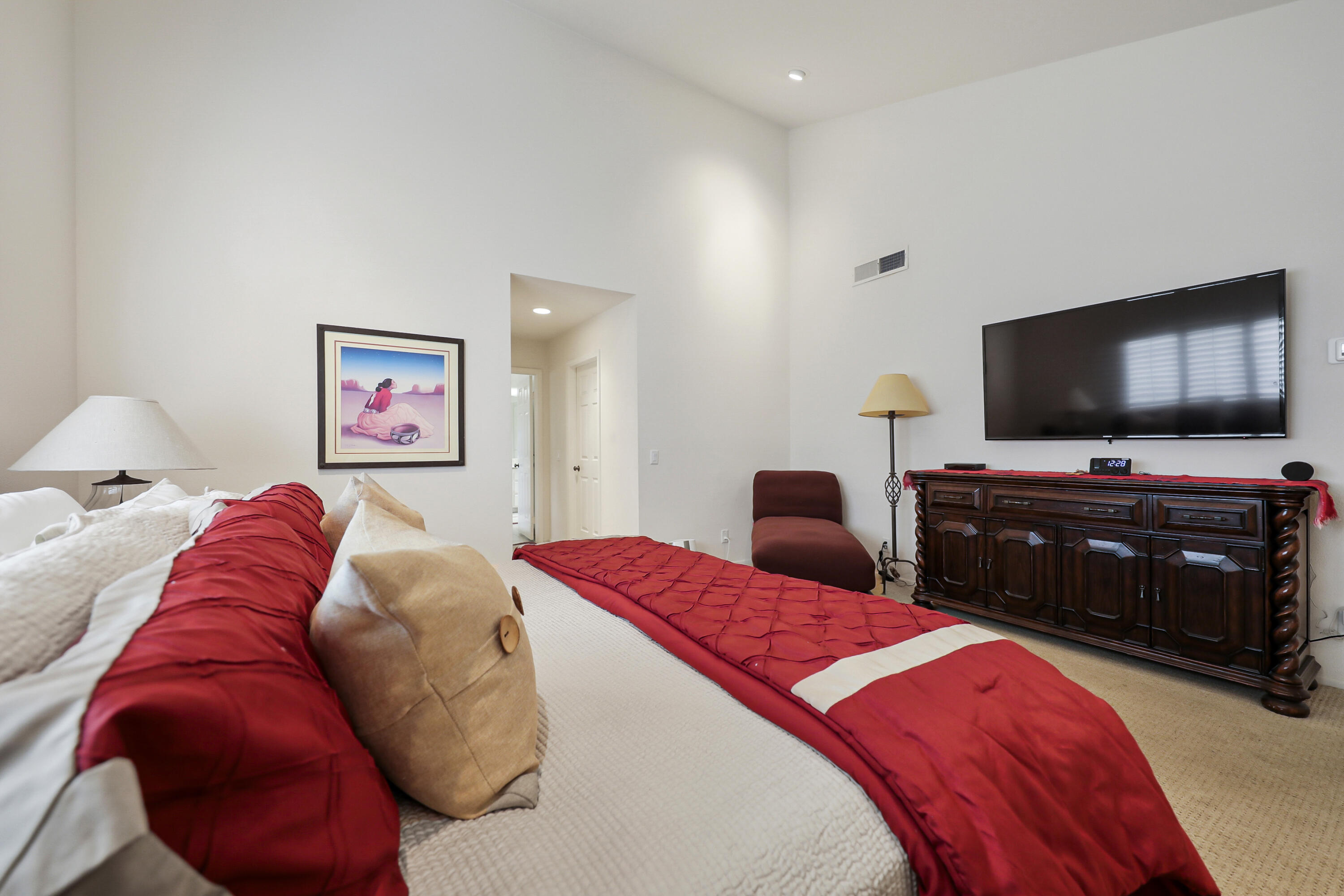148 Deer Spring Way Palm Desert, CA 92211 - Photo 19 of 54 a bedroom with a bed and a flat screen tv