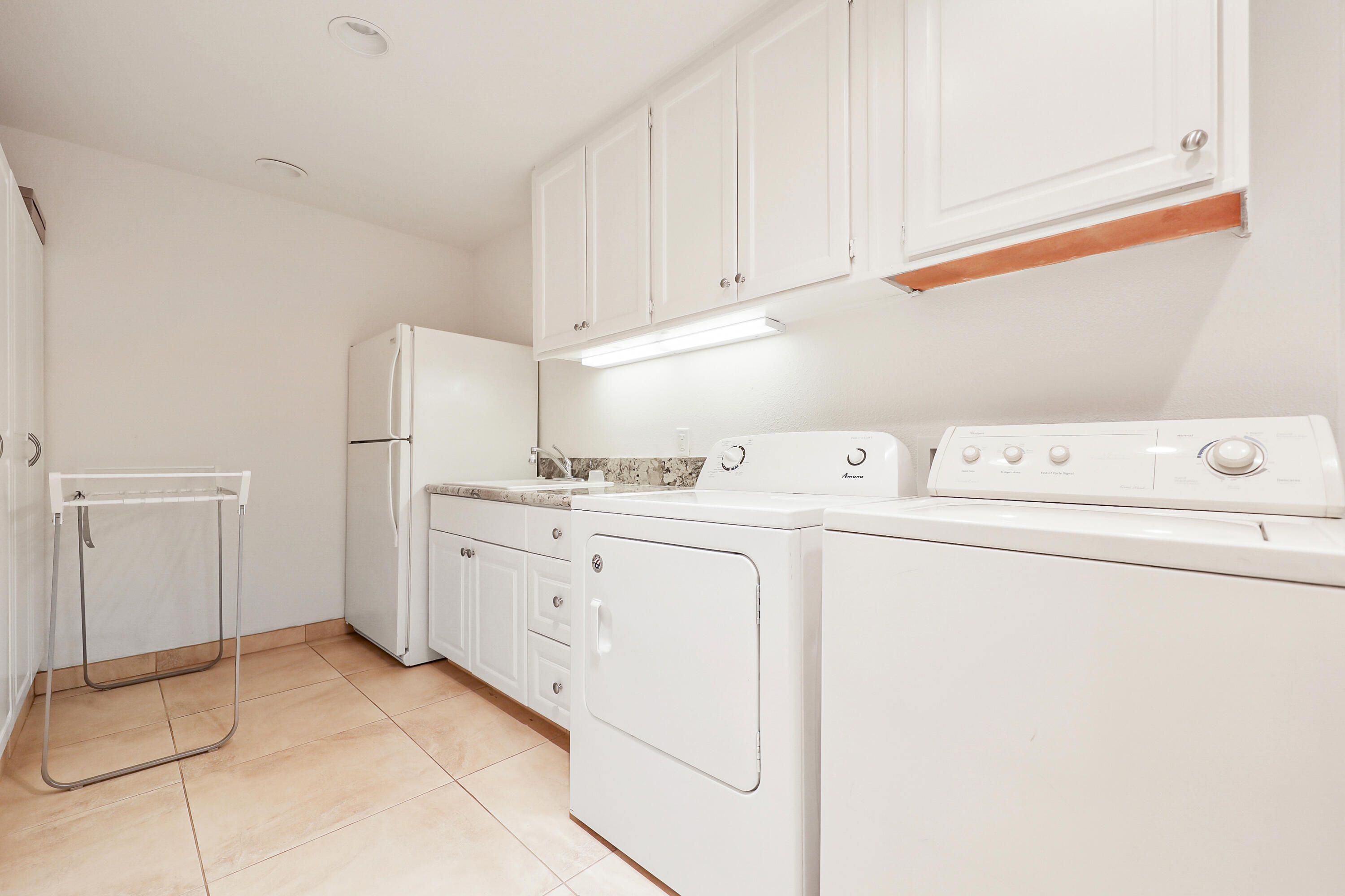 148 Deer Spring Way Palm Desert, CA 92211 - Photo 22 of 54 a utility room with dryer and washer