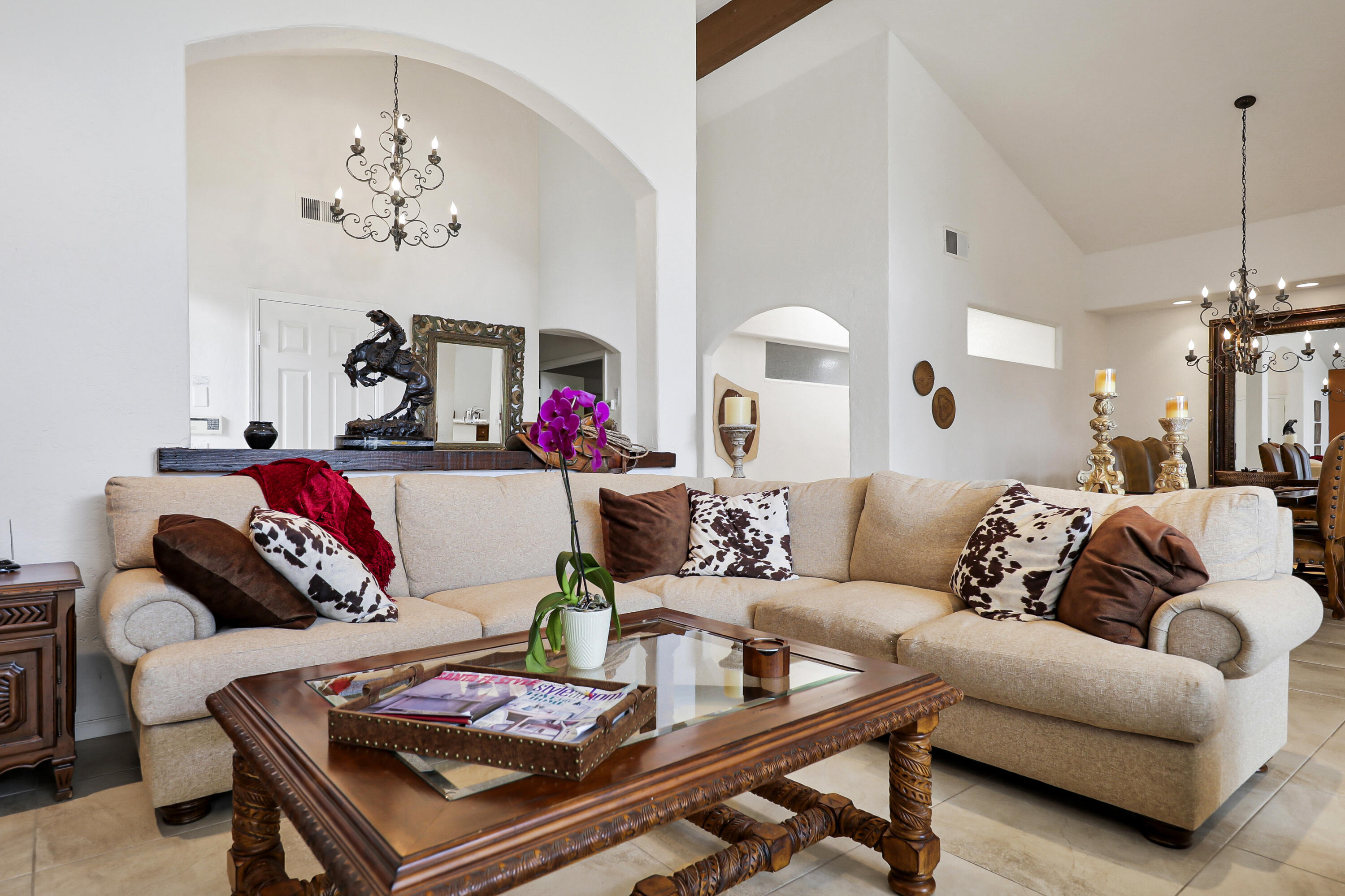 148 Deer Spring Way Palm Desert, CA 92211 - Photo 3 of 54 a living room with furniture and a chandelier