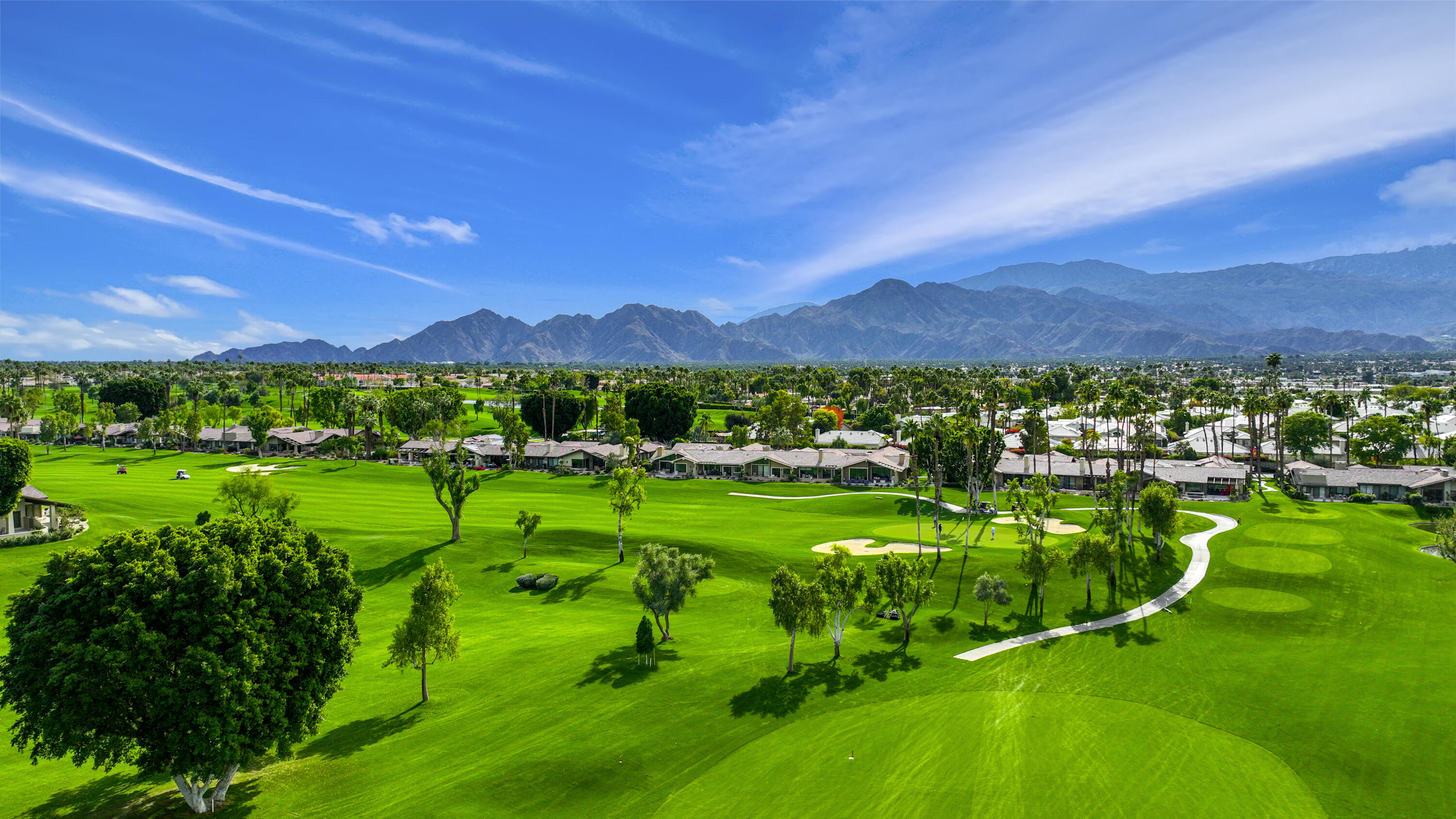148 Deer Spring Way Palm Desert, CA 92211 - Photo 36 of 54 a view of a big yard with lots of green space and mountain view