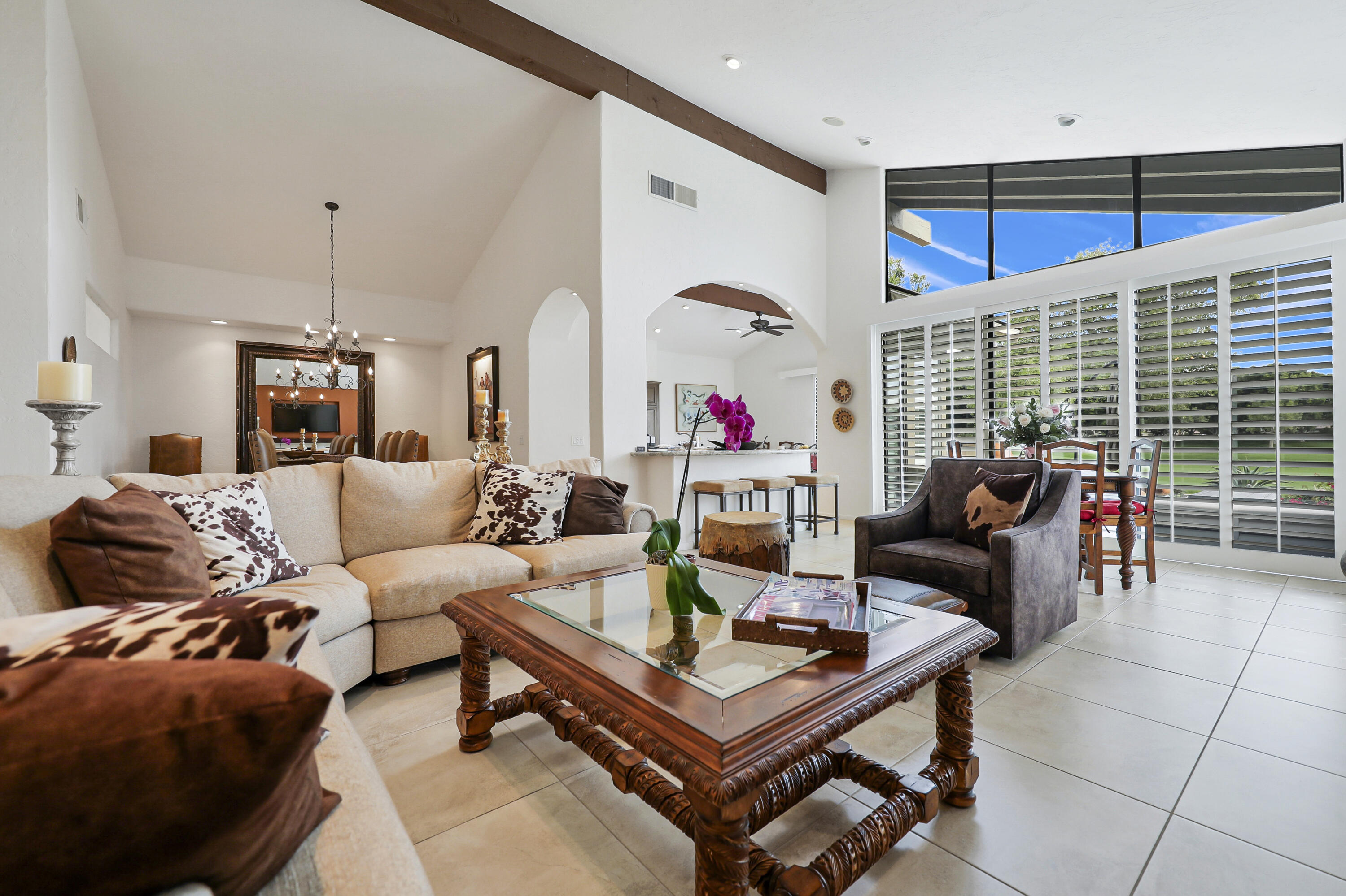 148 Deer Spring Way Palm Desert, CA 92211 - Photo 4 of 54 a living room with furniture a rug and white walls