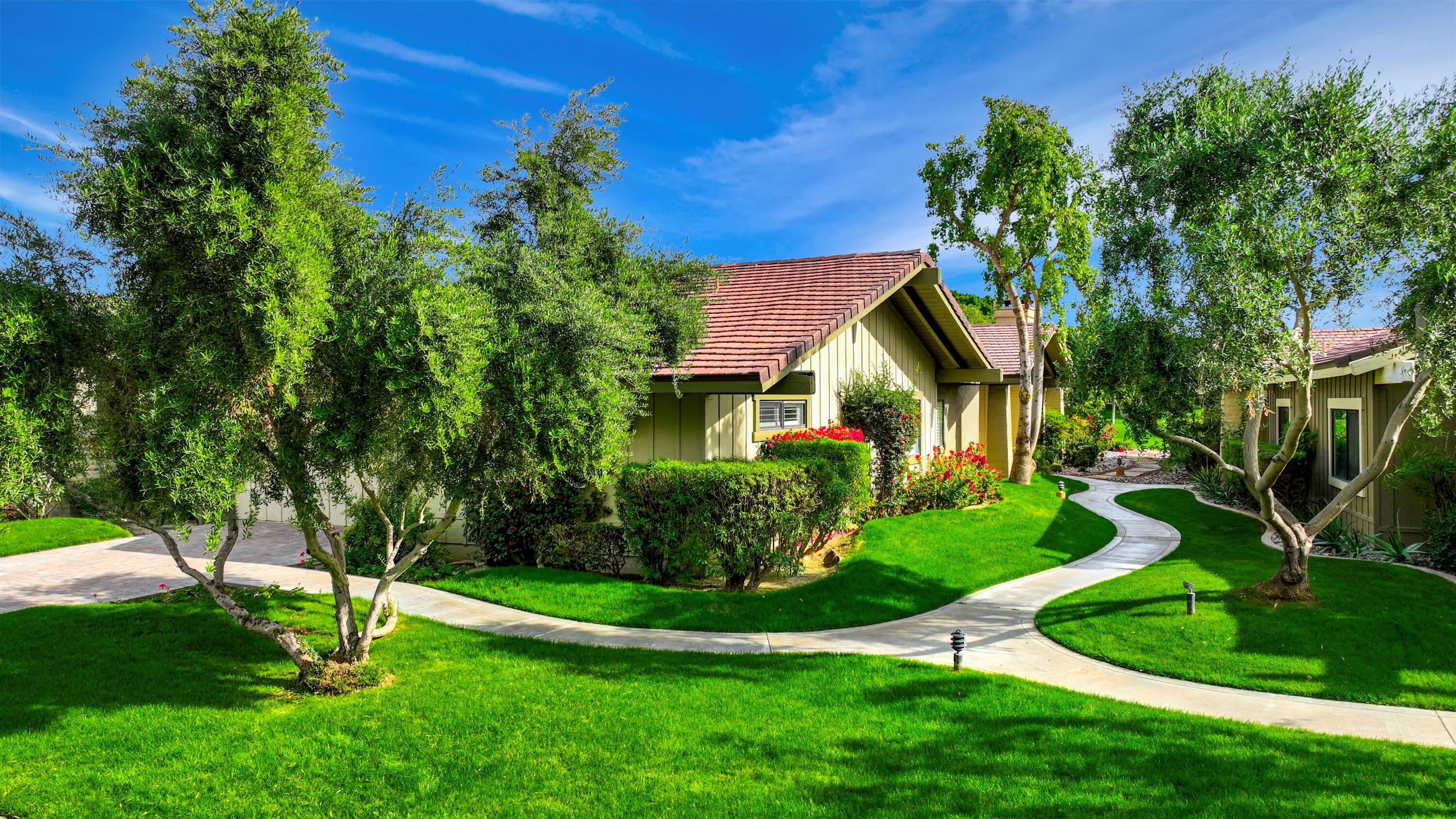 148 Deer Spring Way Palm Desert, CA 92211 - Photo 51 of 54 a view of a house with a yard