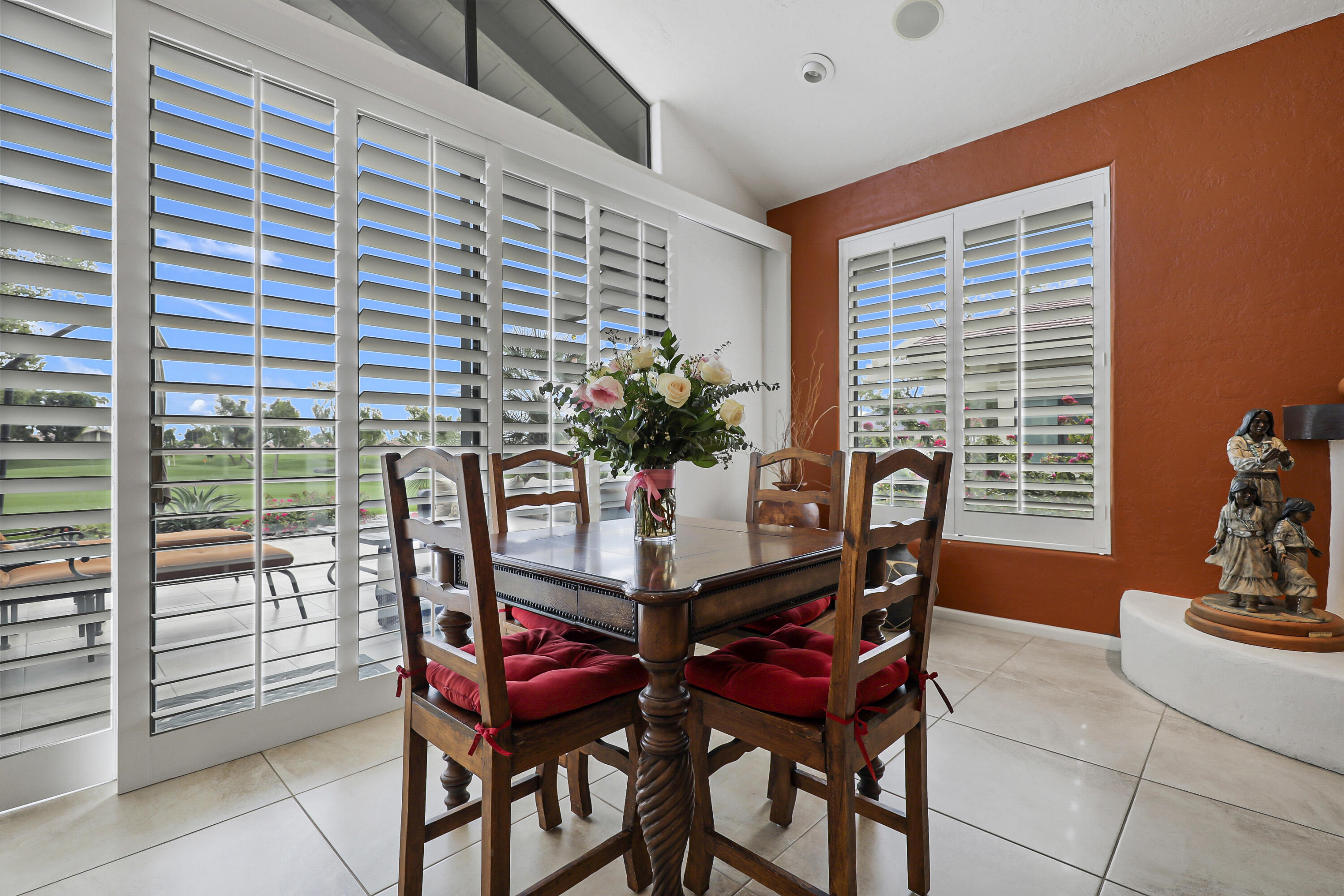 148 Deer Spring Way Palm Desert, CA 92211 - Photo 6 of 54 a dining room with furniture and potted plants