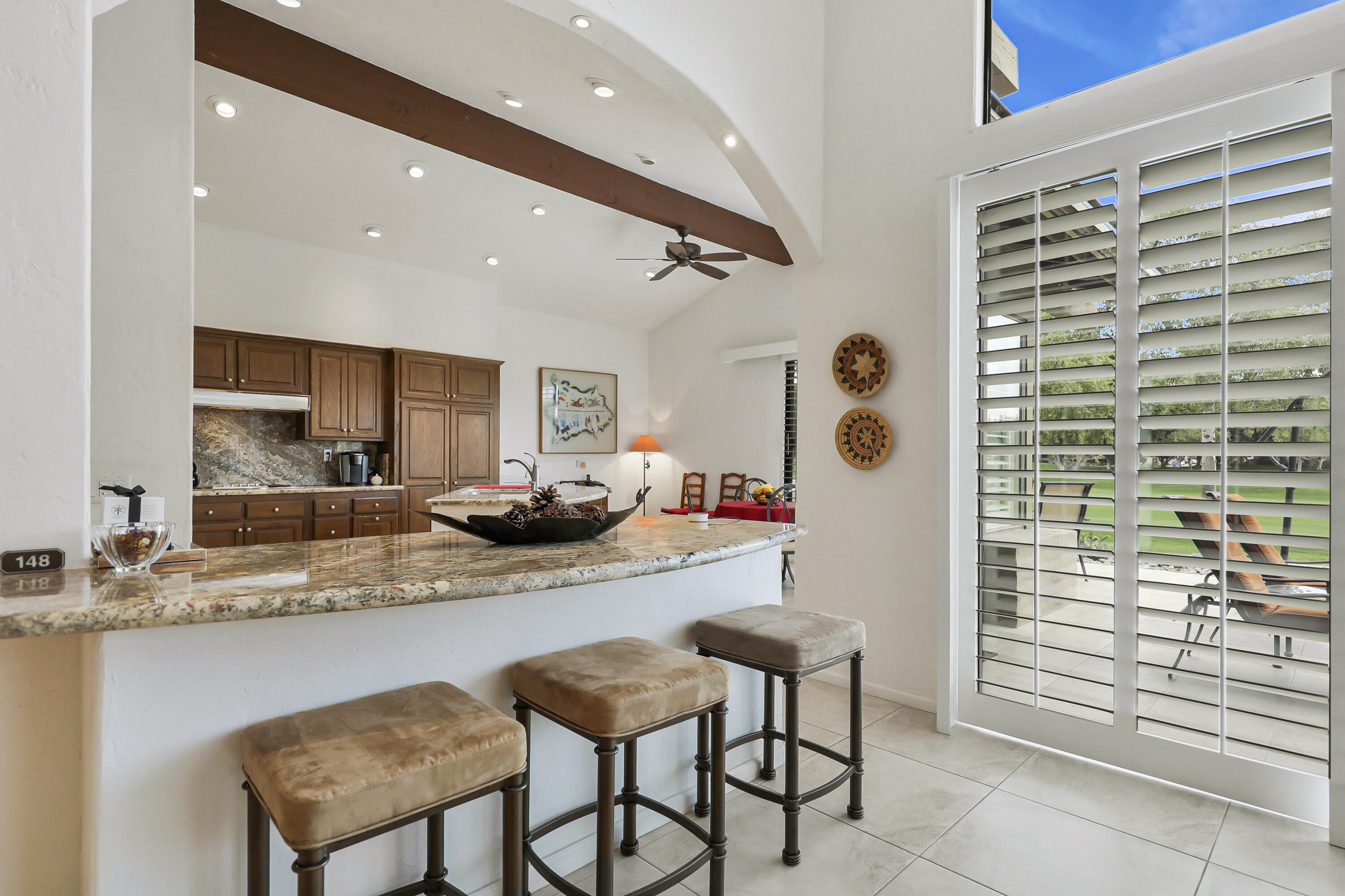 148 Deer Spring Way Palm Desert, CA 92211 - Photo 10 of 54 a kitchen with stainless steel appliances granite countertop a sink and cabinets