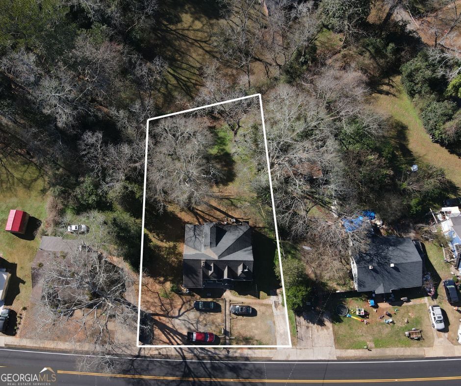711 West Main Street Thomaston, GA 30286 - Photo 3 of 3 a backyard of a house with lots of green space