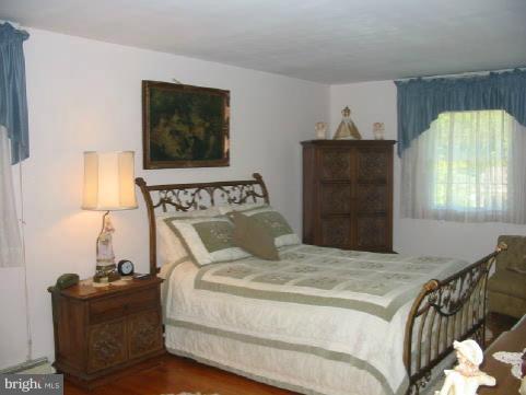 1108 Sturbridge Road Fallston, MD 21047 - Photo 22 of 26 a bedroom with a bed and window