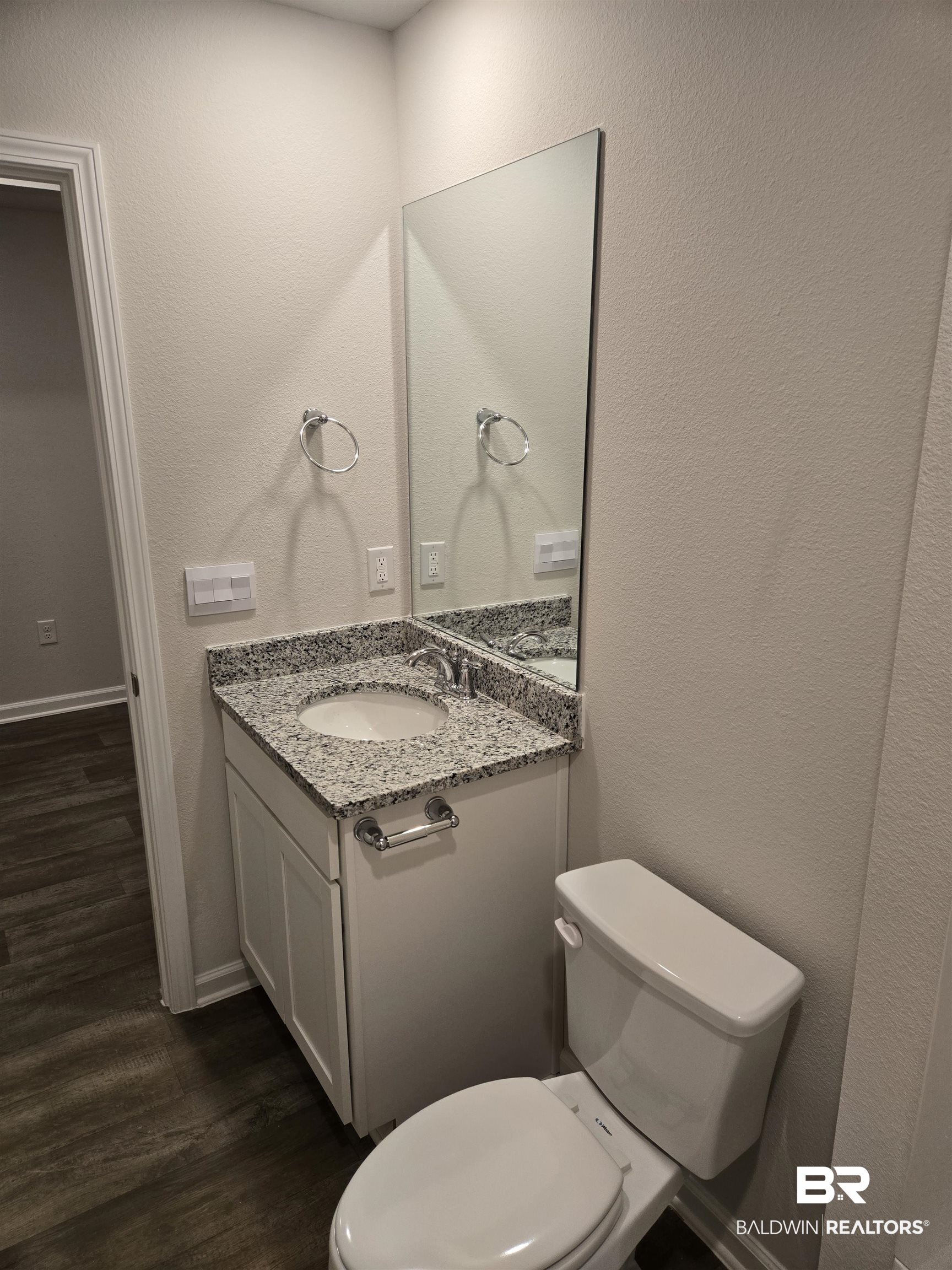 24194 Veranda Circle Elberta, AL 36530 - Photo 7 of 31 Bathroom with vanity, wood-type flooring, and toilet