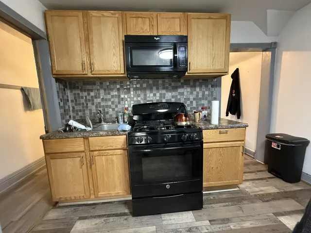 a kitchen with a stove and a microwave