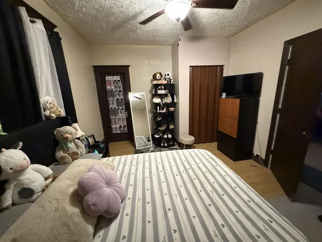 a kitchen with a refrigerator and a stove top oven