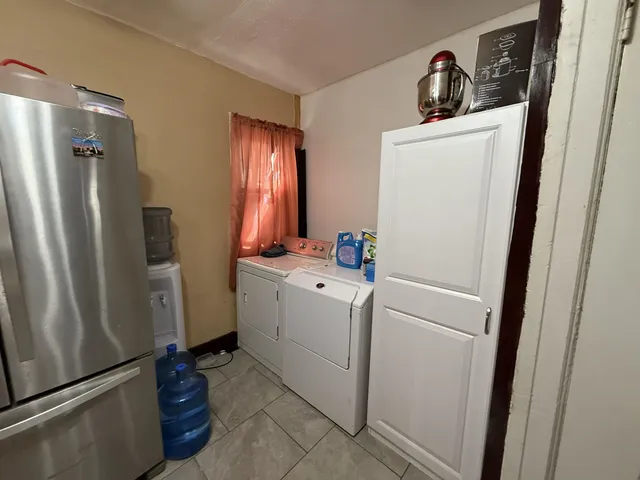 a kitchen with stainless steel appliances a sink and a refrigerator