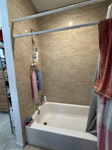 a dining room with furniture and a chandelier