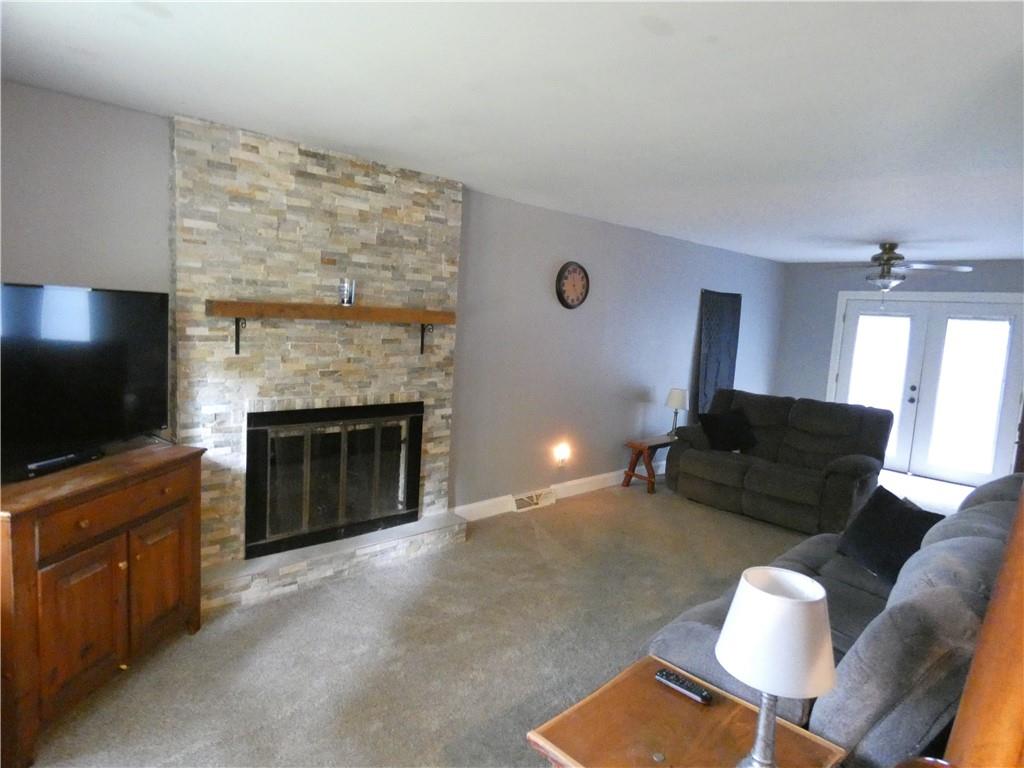 447 Pfeifer Road Prospect, PA 16052 - Photo 6 of 14 a living room with furniture and a flat screen tv