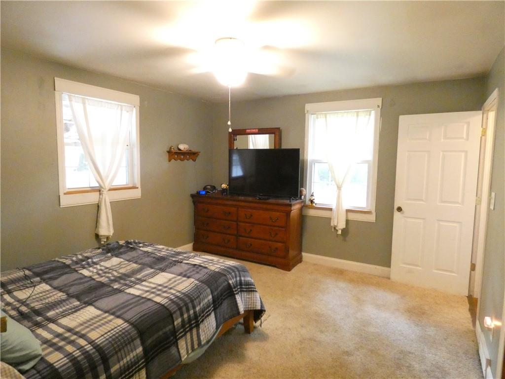 447 Pfeifer Road Prospect, PA 16052 - Photo 8 of 14 a bedroom with a bed and a flat screen tv