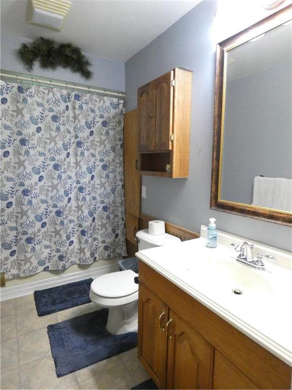 447 Pfeifer Road Prospect, PA 16052 - Photo 10 of 14 a bathroom with a granite countertop toilet sink and mirror