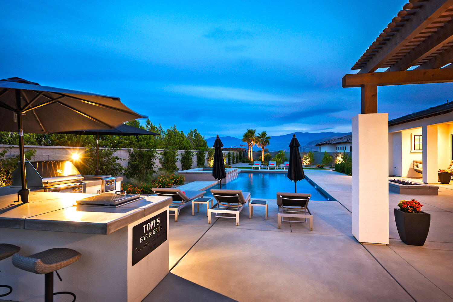 7 Siena Vista Rancho Mirage, CA 92270 - Photo 20 of 26 a view of a patio with a table and chairs under an umbrella