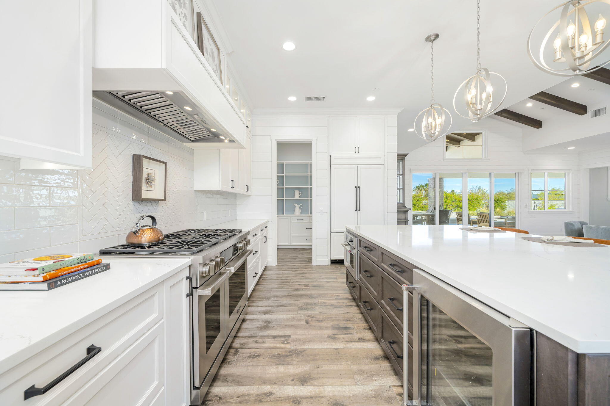 7 Siena Vista Rancho Mirage, CA 92270 - Photo 8 of 26 a kitchen with stainless steel appliances granite countertop a sink and stove