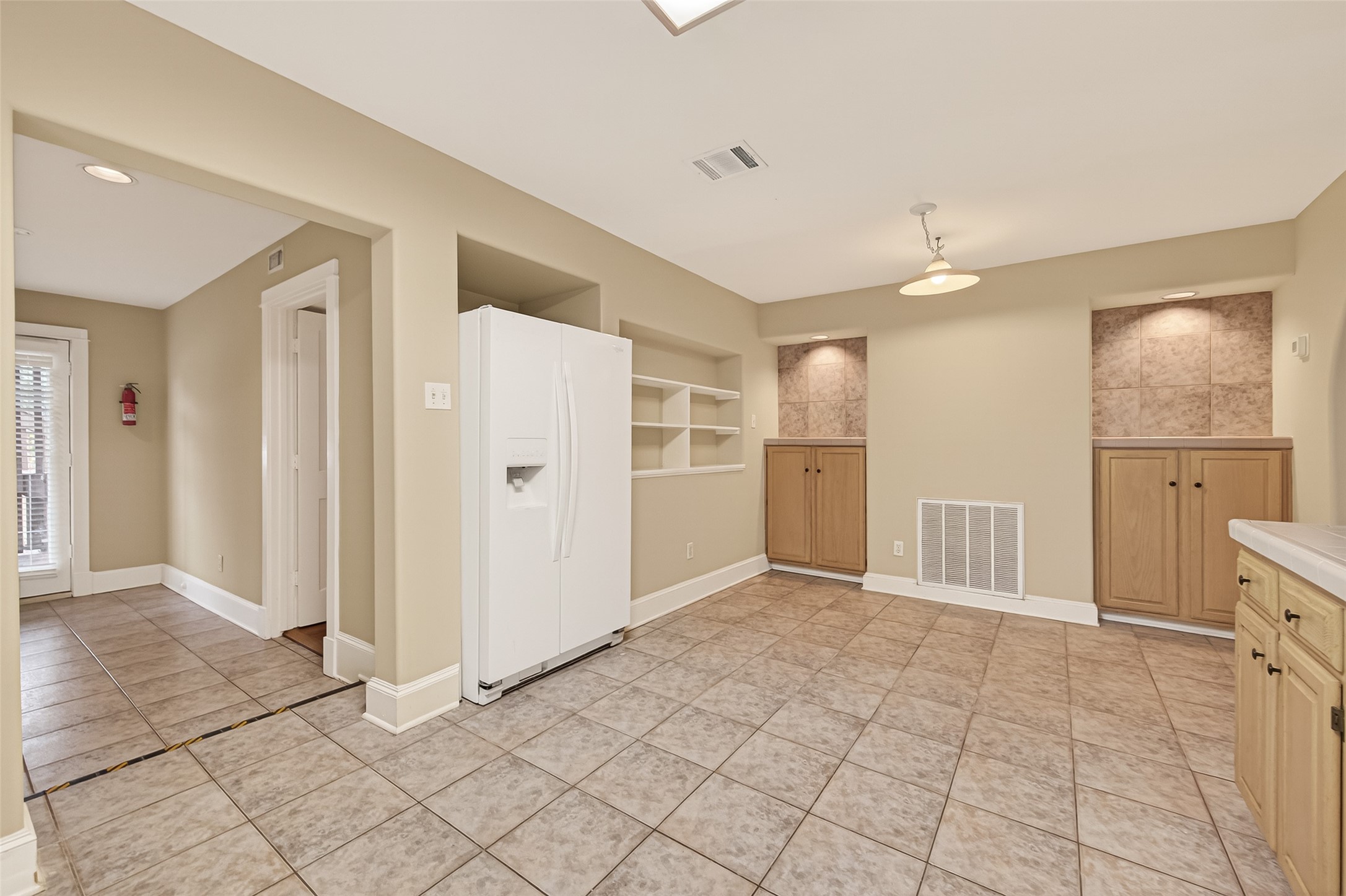 1807 Crocker Street, Unit A Houston, TX 77006 - Photo 13 of 37 Just past the kitchen is the laundry and mudroom -- shown at far left. The double-door fridge can be seen in this photo.