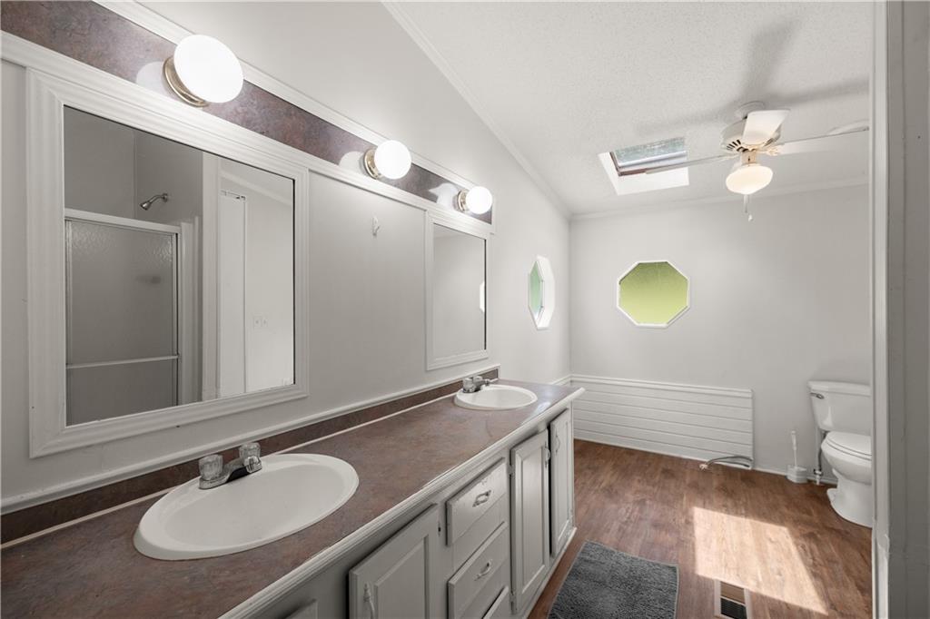 1000 Jim Johnson Road Northwest Winder, GA 30680 - Photo 16 of 37 a bathroom with a granite countertop sink and a mirror