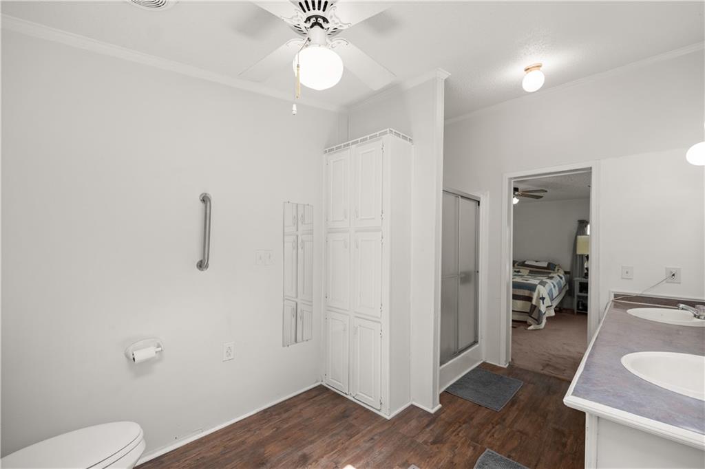 1000 Jim Johnson Road Northwest Winder, GA 30680 - Photo 17 of 37 a very nice looking room with a wooden floor