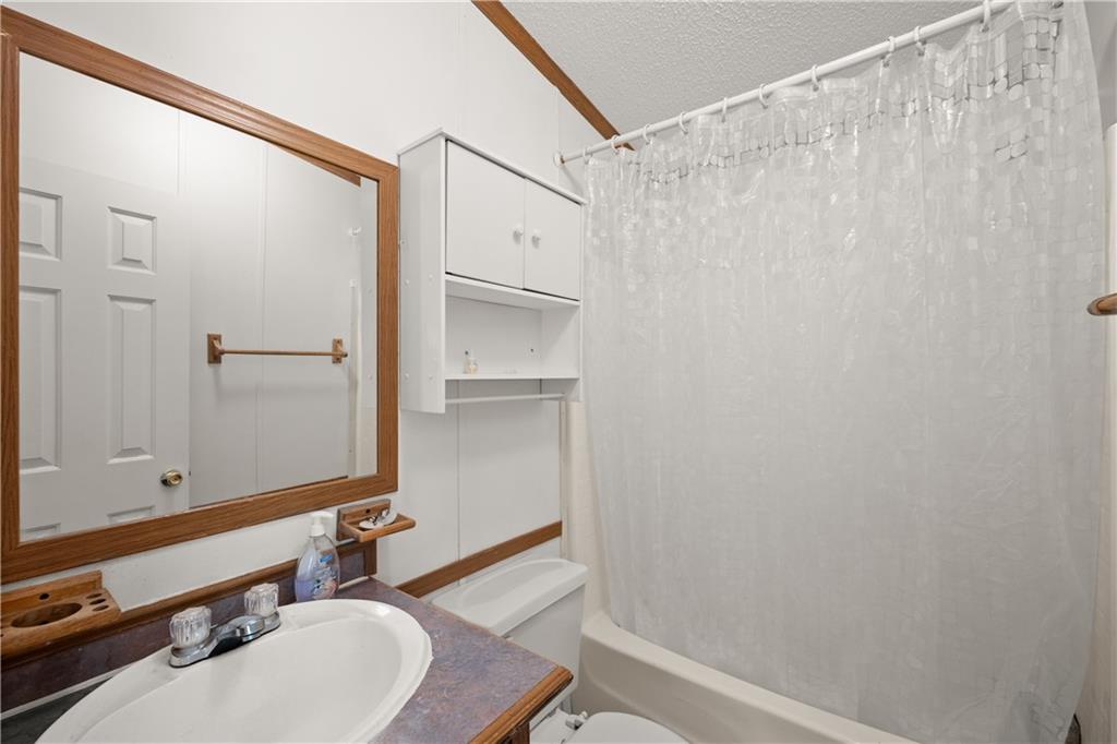 1000 Jim Johnson Road Northwest Winder, GA 30680 - Photo 22 of 37 a bathroom with a sink and a mirror