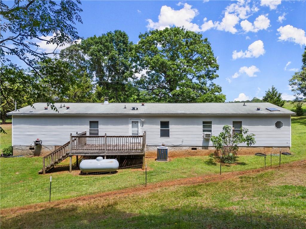1000 Jim Johnson Road Northwest Winder, GA 30680 - Photo 24 of 37 a house view with a garden space