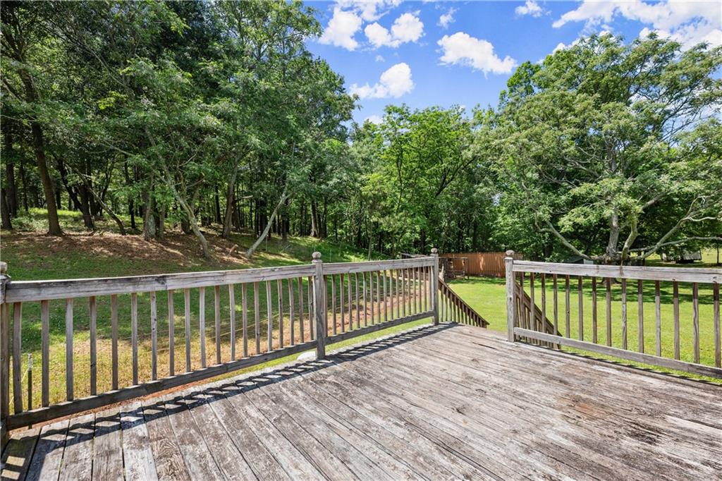 1000 Jim Johnson Road Northwest Winder, GA 30680 - Photo 26 of 37 a view of a balcony with wooden floor and fence