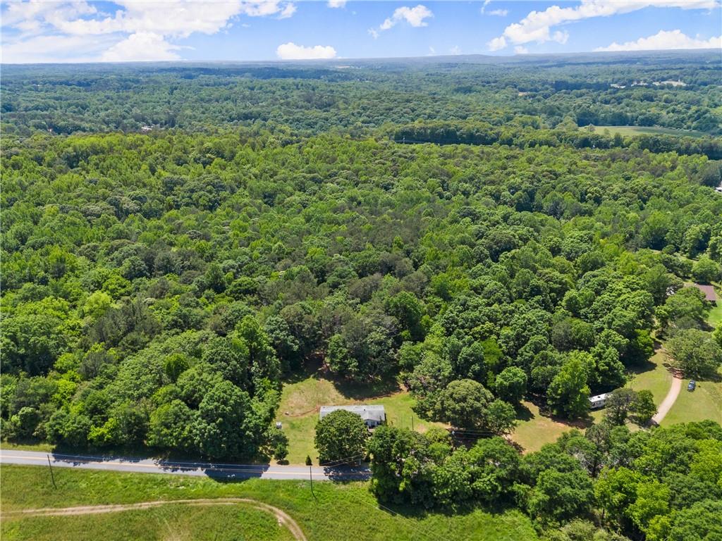 1000 Jim Johnson Road Northwest Winder, GA 30680 - Photo 35 of 37 a view of a lush green outdoor space with a lake view and mountain view
