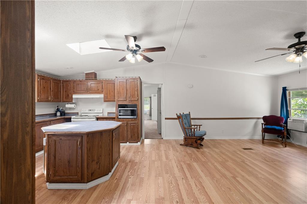 1000 Jim Johnson Road Northwest Winder, GA 30680 - Photo 8 of 37 a kitchen with a sink and wooden floor
