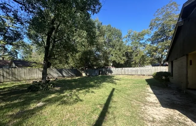 a view of swimming pool with a backyard