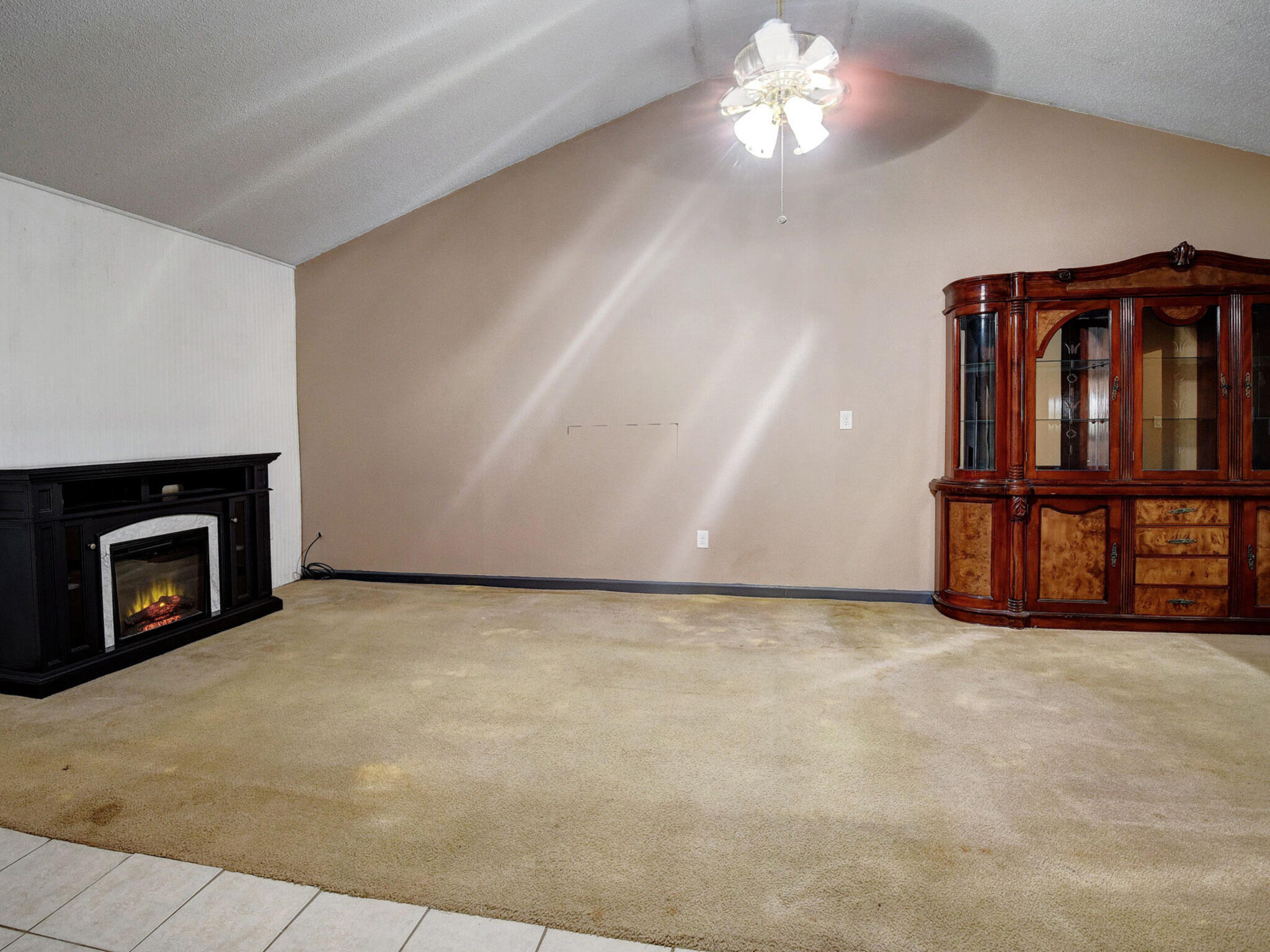 176 Lacy Drive Elgin, TX 78621 - Photo 11 of 40 a view of an empty room with a fireplace and a window