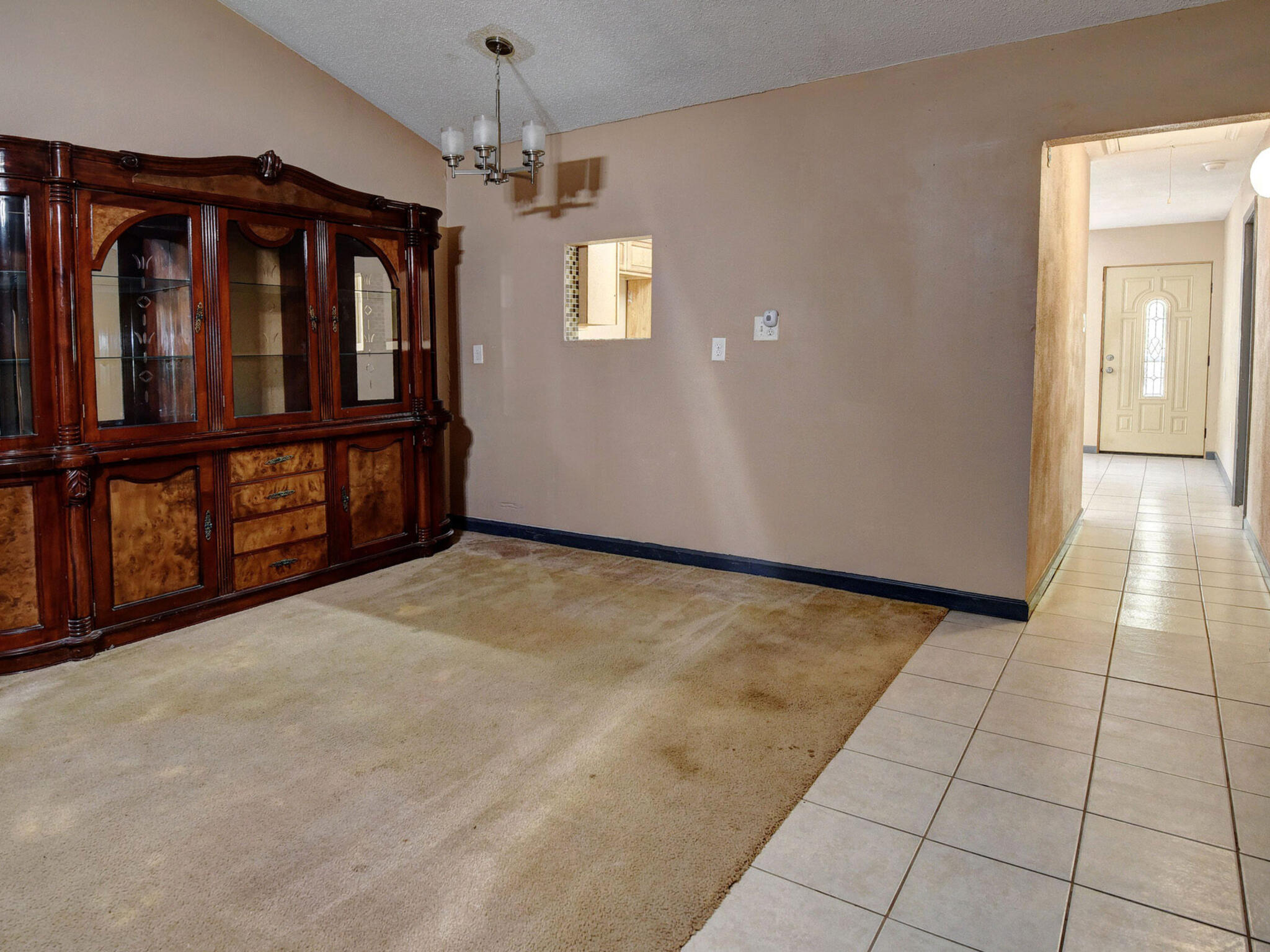 176 Lacy Drive Elgin, TX 78621 - Photo 14 of 40 a view of an empty room with window and chandelier fan