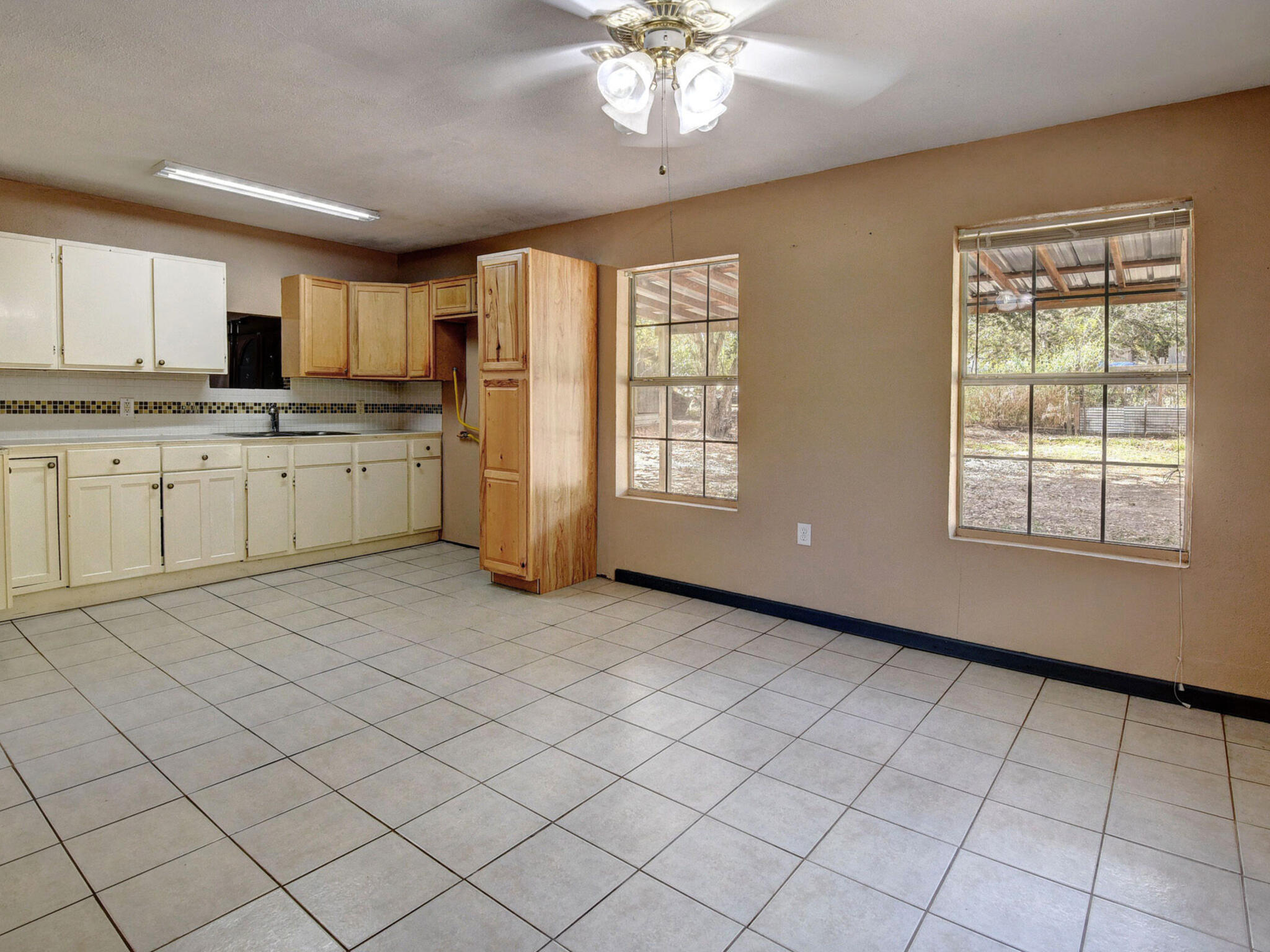 176 Lacy Drive Elgin, TX 78621 - Photo 16 of 40 a open kitchen with cabinets a sink and appliances