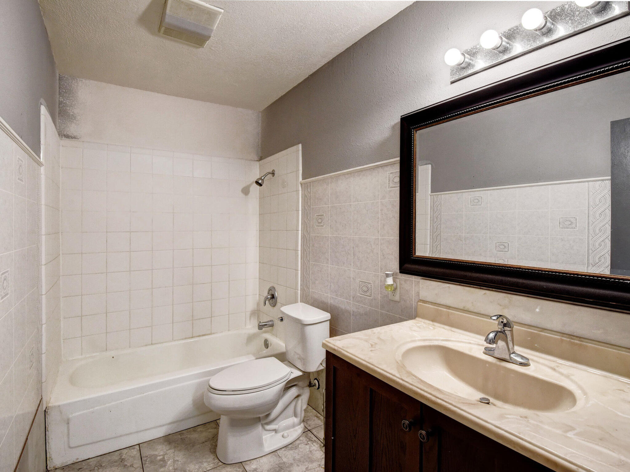 176 Lacy Drive Elgin, TX 78621 - Photo 26 of 40 a bathroom with a sink a toilet and shower