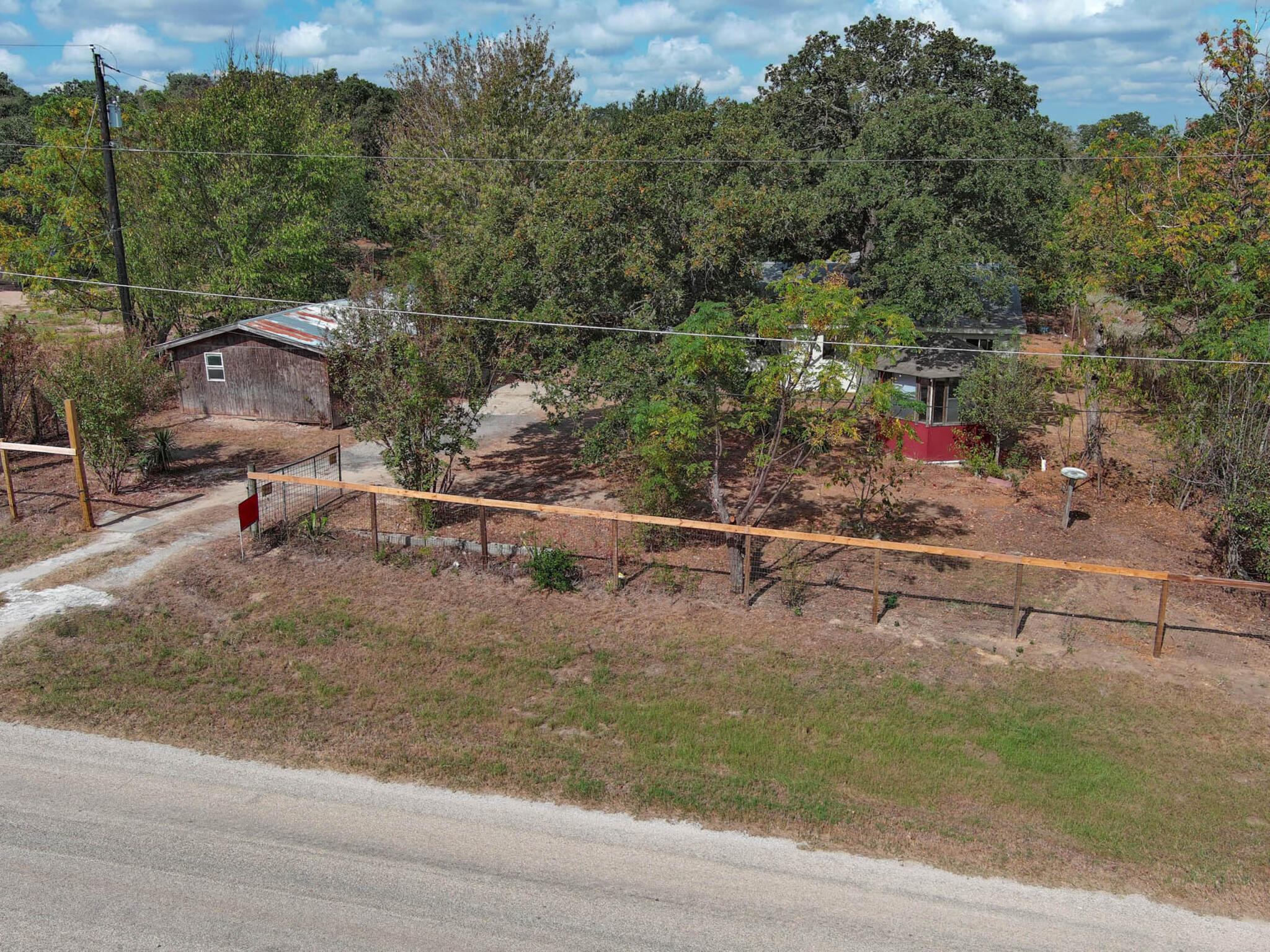 176 Lacy Drive Elgin, TX 78621 - Photo 40 of 40 an aerial view of a yard with table chairs and potted plants